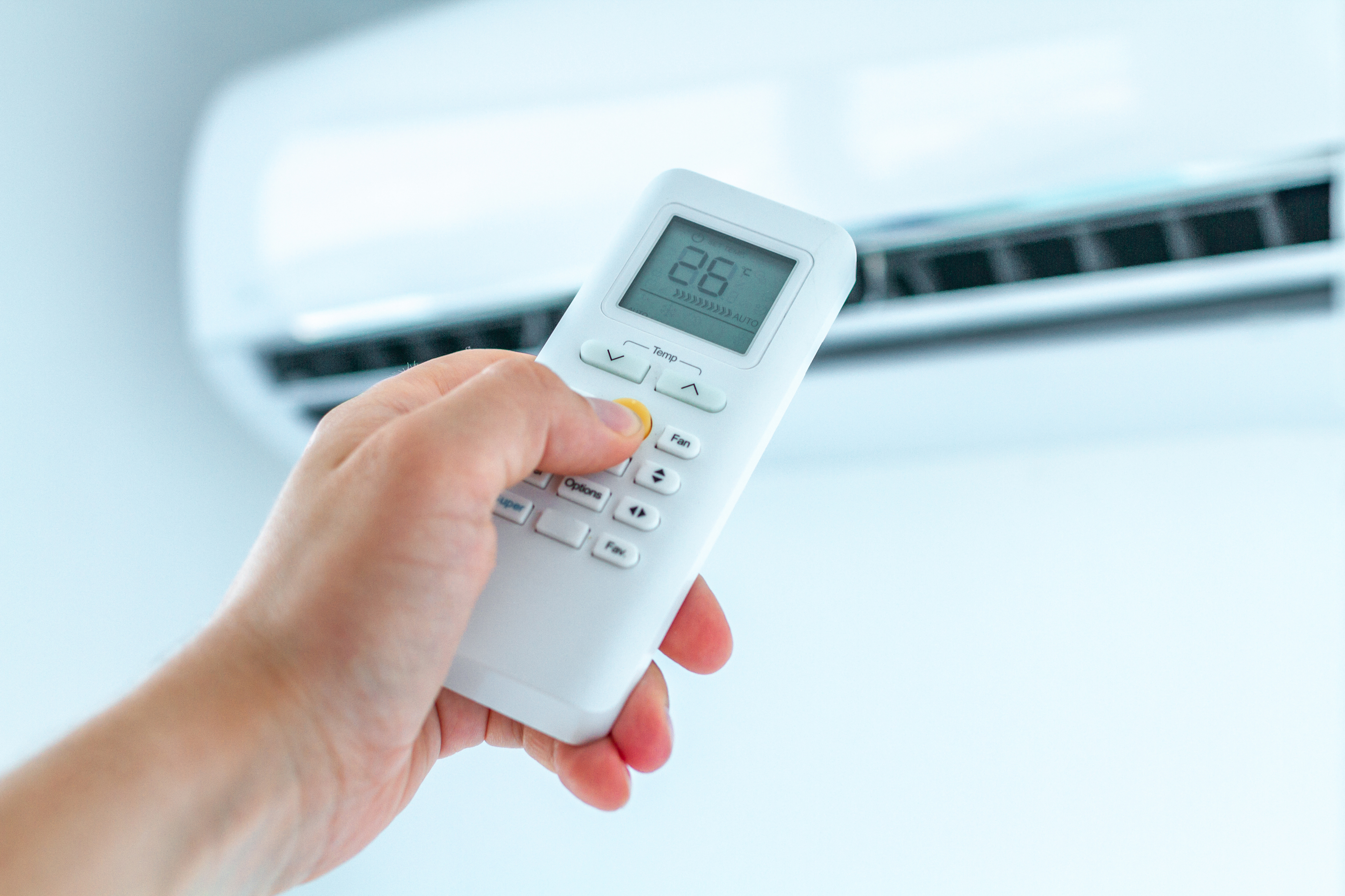 Air conditioner temperature adjustment with remote controller in